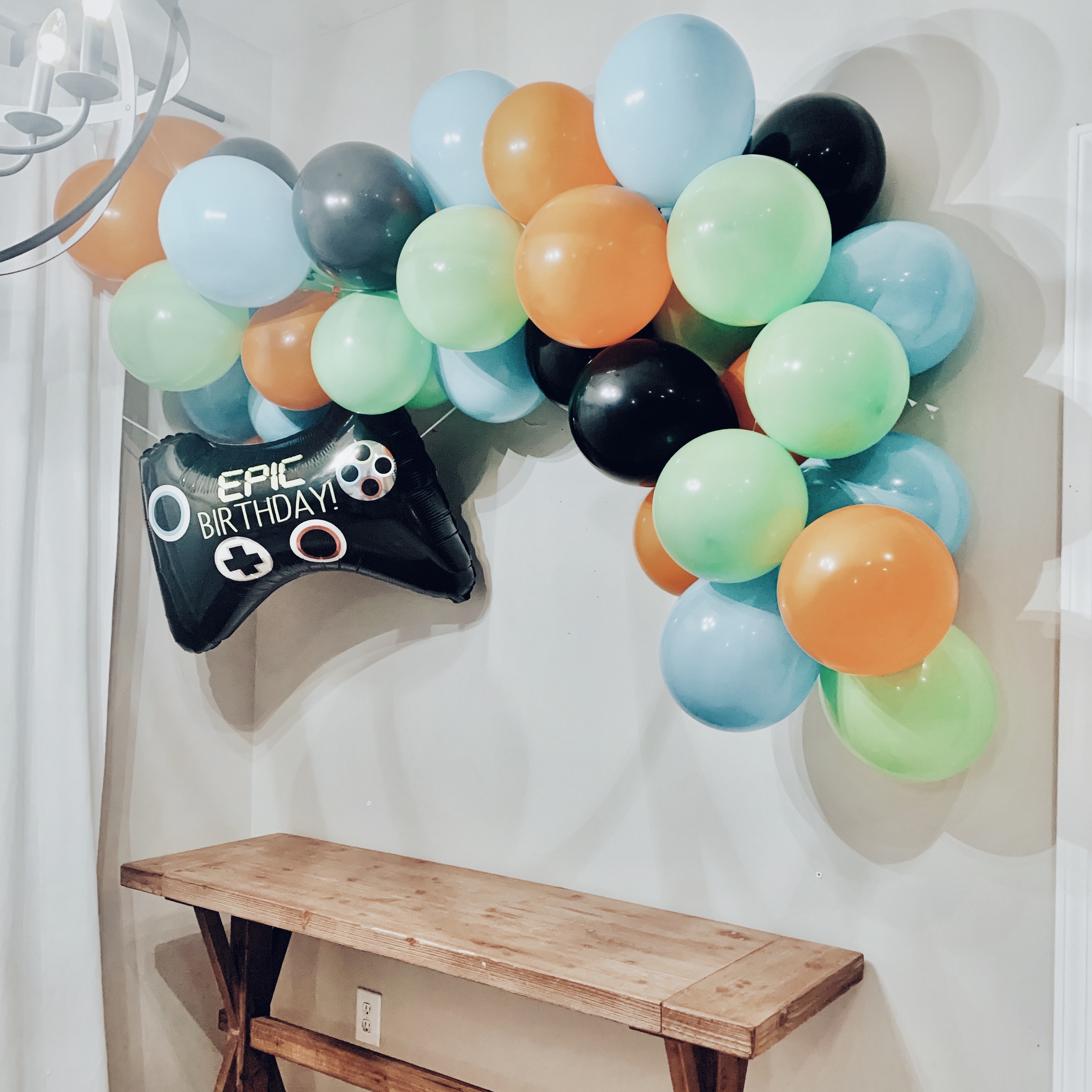 Easiest Way to Hang a Balloon Garland on Your Wall - Tandra Nicole